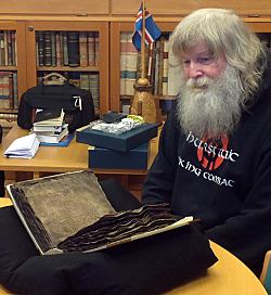 Dr. Short with medieval saga manuscript